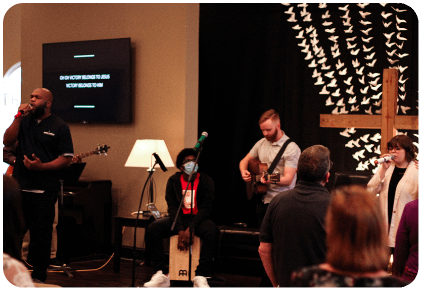 local vineyard church in midlothian worship team playing songs in front of the congregation